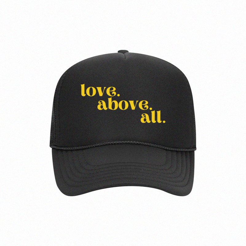 love above all trucker cap