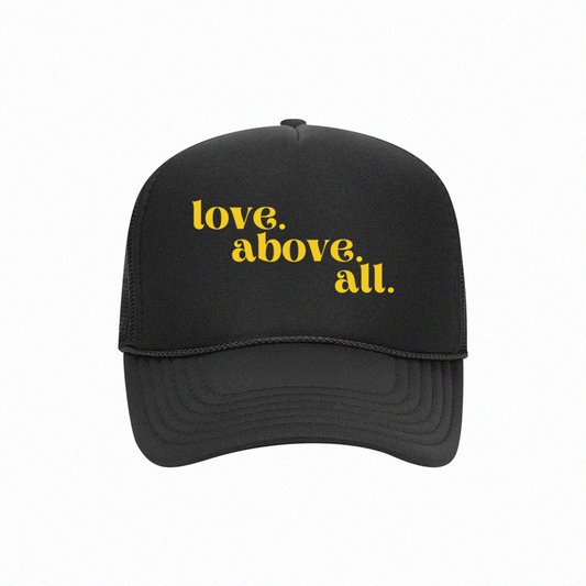 love above all trucker cap