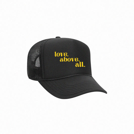 love above all trucker cap